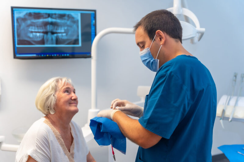 dental implants vs dentures, woman deciding what is the best option