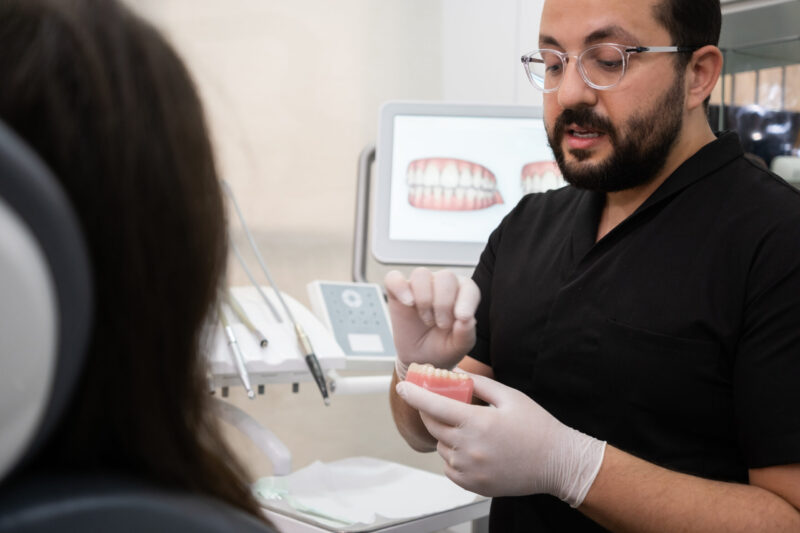 orthodontist explaining treatment for teeth