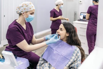 young girl at orthodontist getting Invisalign