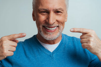 patient properly maintaining his dental implants