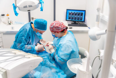 oral surgeons working on full arch dental implant procedure