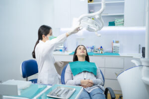 young woman at dentist interested in dental bonding 