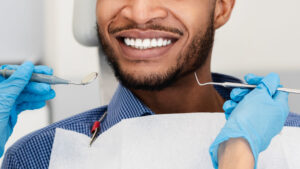 young man smiling with his new veneers